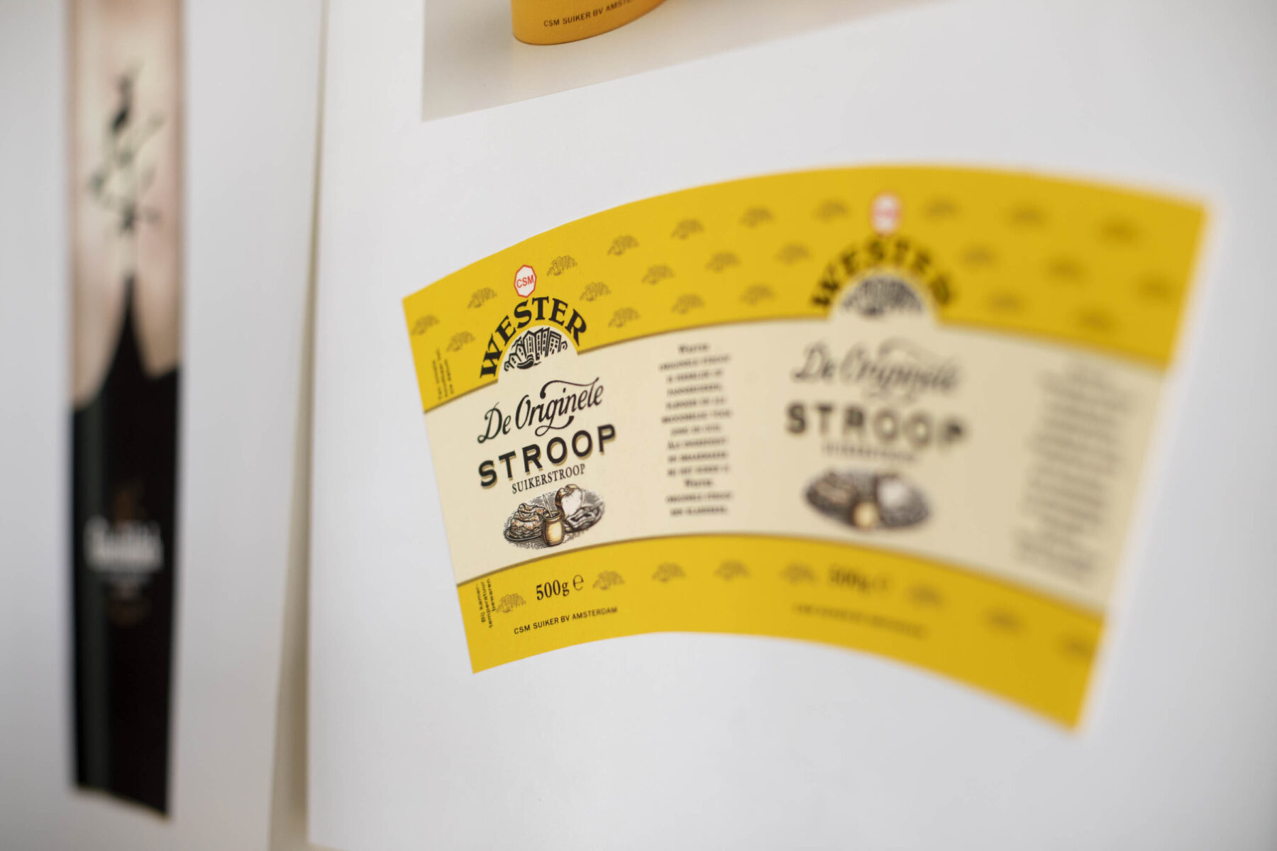 Wester Stroop pacakaging. Yellow carton with illustrations and typography.