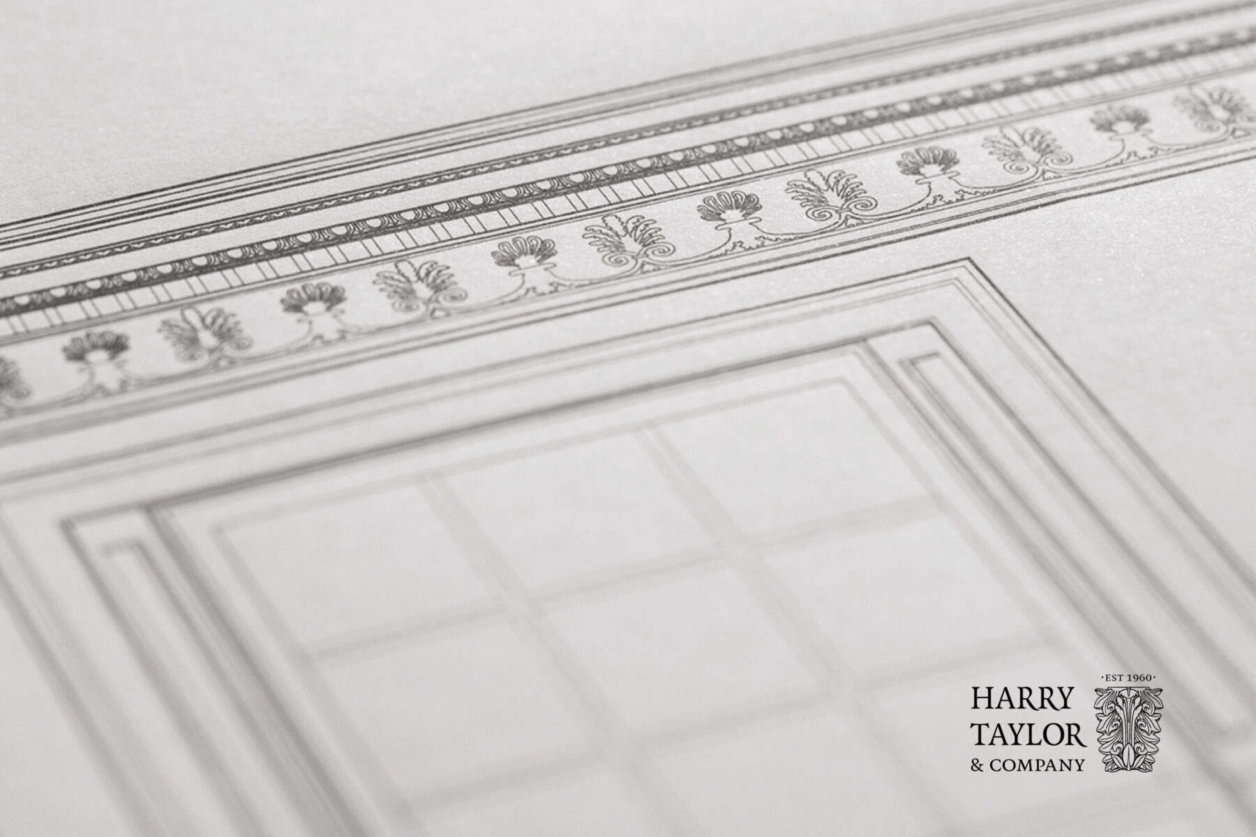 Harry Taylor logo overlaid on architectural ornamental drawing.